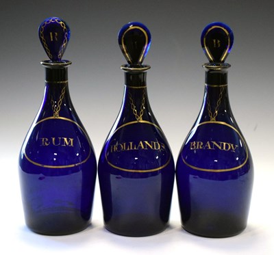 Lot 481 - Three blue decanter bottles