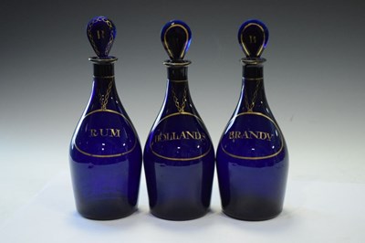 Lot 481 - Three blue decanter bottles