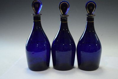 Lot 481 - Three blue decanter bottles