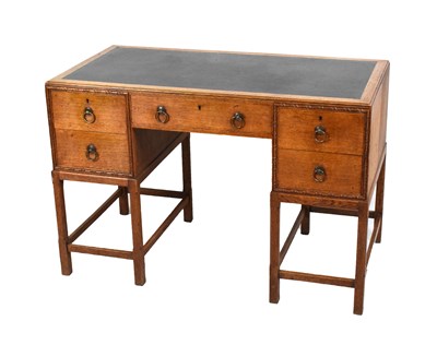 Lot 523 - 1920s Arts and Crafts oak desk, in the style of Gordon Russell of Broadway