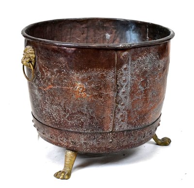 Lot 506 - Copper log bin with gilt lion head handles