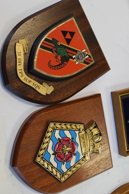 Lot 299 - Seven mounted regimental crests