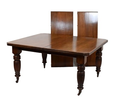 Lot 454 - Late Victorian/Edwardian walnut dining table with two leaves