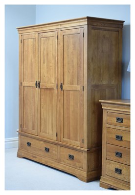 Lot 610 - Modern light oak triple wardrobe