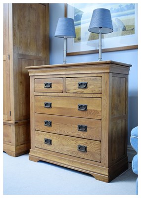 Lot 622 - Modern light oak chest of two short over three long drawers