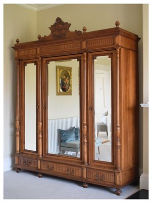 Lot 542 - 19th Century French walnut triple wardrobe