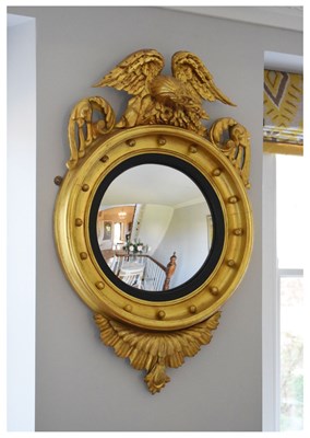 Lot 525 - Regency style giltwood convex wall mirror