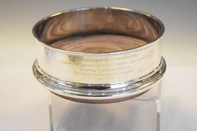 Lot 176 - Elizabeth II silver bottle coaster together with a pair of plated wine coasters