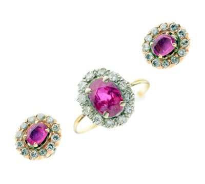 Lot 31 - Yellow metal, ruby, and diamond cluster ring, and matching earrings