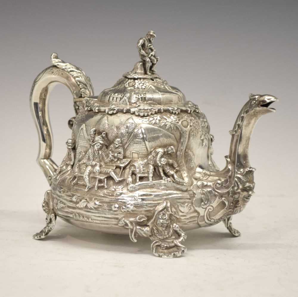 Lot 77 - Early Victorian silver teapot decorated with tavern scenes in the manner of David Teniers