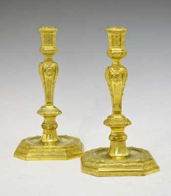 Lot 177 - Pair of gilt brass candlesticks in the Louis XIV taste