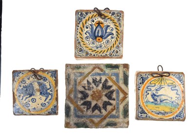 Lot 321 - Three 17th Century Dutch Delft tiles, together with a Spanish tile