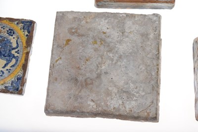 Lot 321 - Three 17th Century Dutch Delft tiles, together with a Spanish tile