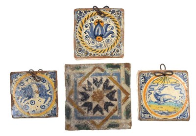 Lot 321 - Three 17th Century Dutch Delft tiles, together with a Spanish tile