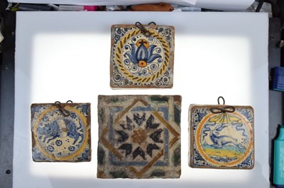 Lot 321 - Three 17th Century Dutch Delft tiles, together with a Spanish tile