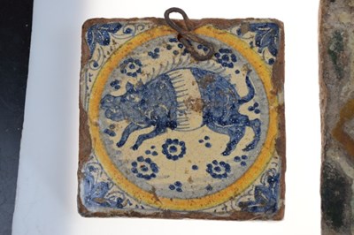 Lot 321 - Three 17th Century Dutch Delft tiles, together with a Spanish tile