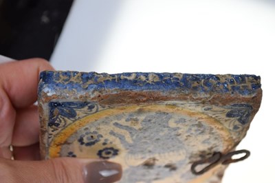 Lot 321 - Three 17th Century Dutch Delft tiles, together with a Spanish tile