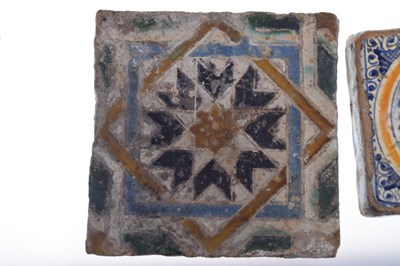 Lot 321 - Three 17th Century Dutch Delft tiles, together with a Spanish tile