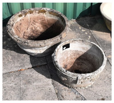 Lot 663 - Two circular composite stone garden planters