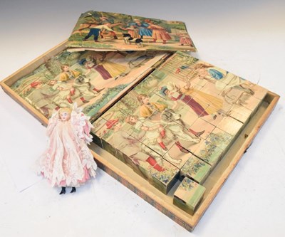 Lot 306 - Victorian wooden jigsaw, with a small bisque headed doll