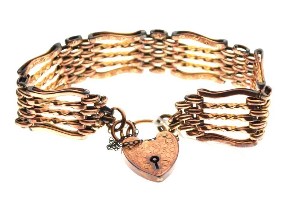 Lot 42 - Unmarked yellow metal gate-link bracelet, with heart shaped lock