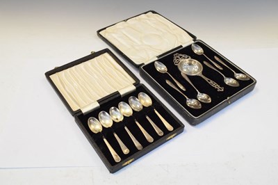 Lot 190 - George V cased silver teaspoons and strainer, together with cased Elizabeth II silver coffee spoons