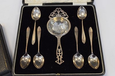 Lot 190 - George V cased silver teaspoons and strainer, together with cased Elizabeth II silver coffee spoons