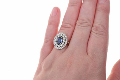 Lot 24 - Sapphire and diamond cluster ring