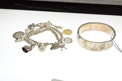 Lot 45 - Silver double-link charm bracelet, attached various charms, and a silver hinged bangle