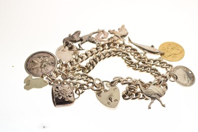 Lot 47 - Silver double-link charm bracelet, attached various charms, and a silver hinged bangle