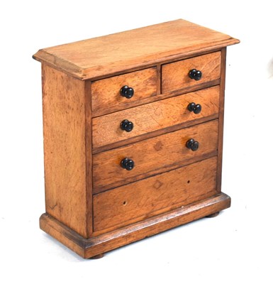 Lot 436 - Miniature oak chest of drawers