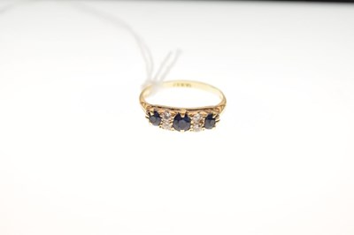 Lot 1 - Yellow metal (18ct) seven-stone sapphire and diamond ring, 2.9g gross approx
