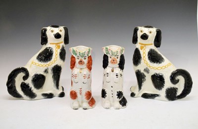 Lot 329 - Staffordshire spaniel jugs, and two large spaniels