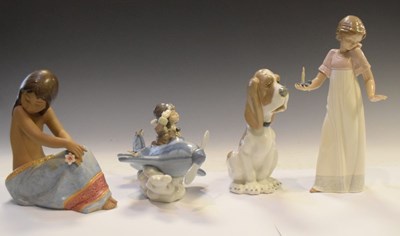 Lot 299 - Lladro 5697 'Over The Clouds' figure and 2382 'Island Beauty' and Nao figures (4)