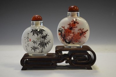 Lot 325 - Two Chinese interior painted glass snuff bottles on stand