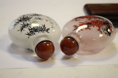Lot 325 - Two Chinese interior painted glass snuff bottles on stand
