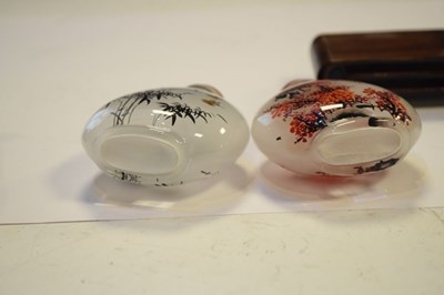 Lot 325 - Two Chinese interior painted glass snuff bottles on stand