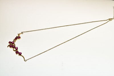 Lot 40 - Yellow metal (750) ruby and diamond pendant