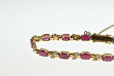 Lot 42 - Unmarked yellow metal, ruby and diamond bracelet