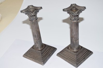 Lot 84 - Set of four Edward VII Corinthian column silver candlesticks
