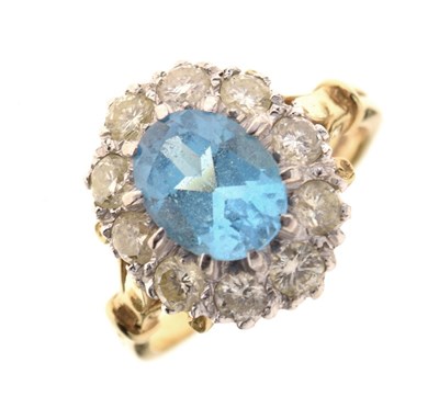 Lot 32 - Blue topaz and diamond 18ct gold cluster ring