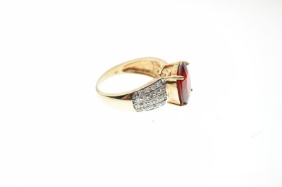 Lot 11 - 9ct gold ring set red stone and diamonds