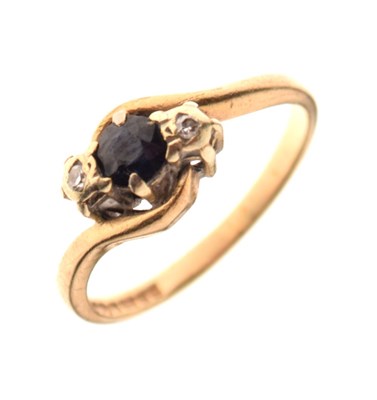 Lot 11 - 9ct gold, sapphire and diamond three-stone crossover ring