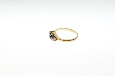 Lot 9 - 9ct gold, sapphire and diamond three-stone crossover ring