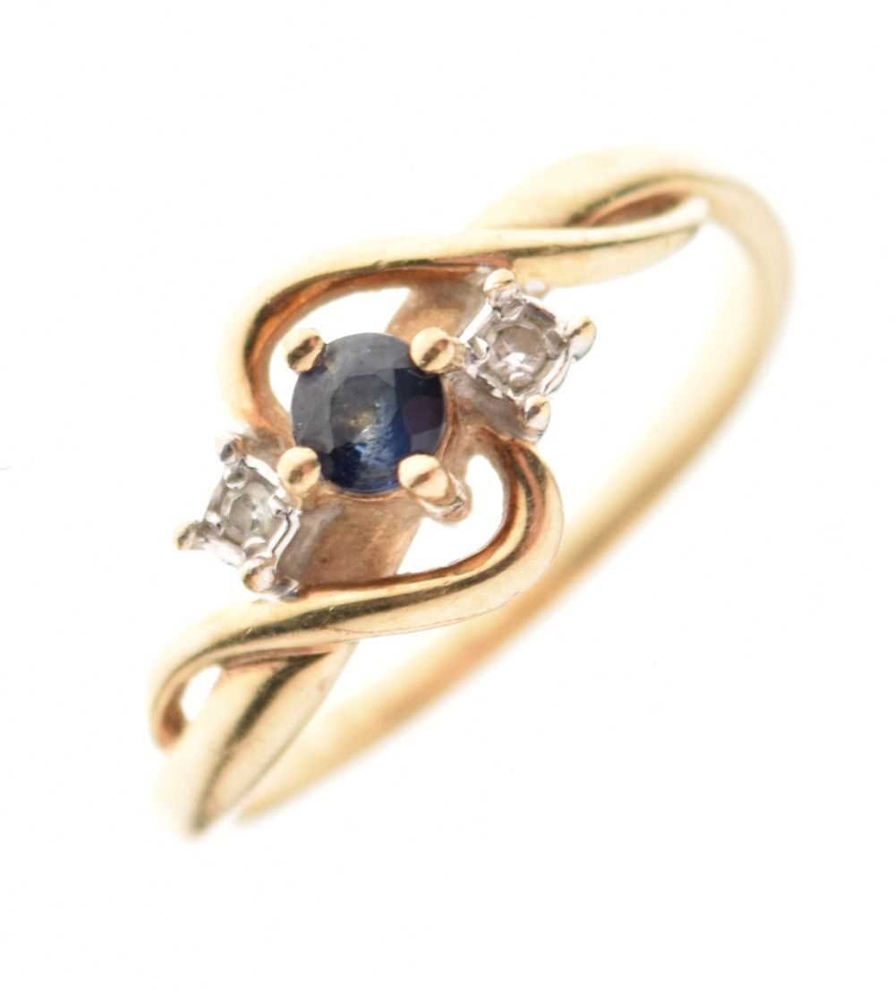 Lot 10 - 9ct gold, sapphire and diamond three-stone crossover ring