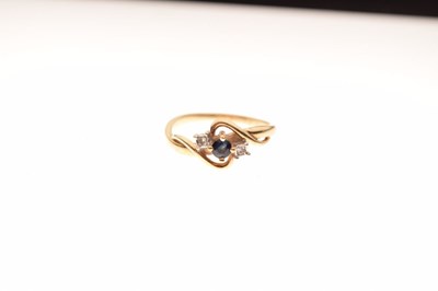 Lot 10 - 9ct gold, sapphire and diamond three-stone crossover ring