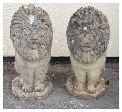 Lot 671 - Pair of stone-effect garden lions