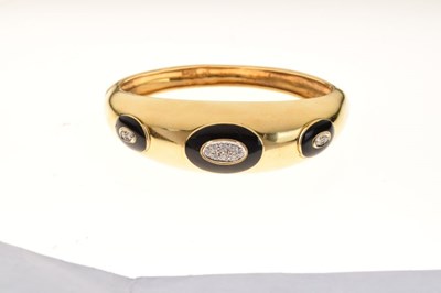 Lot 31 - 18ct gold, diamond and black enamel hinged bangle