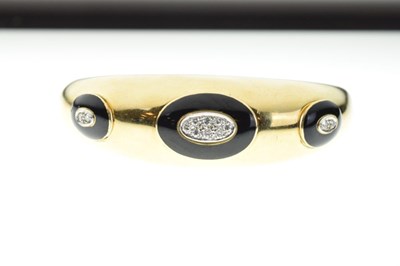 Lot 31 - 18ct gold, diamond and black enamel hinged bangle