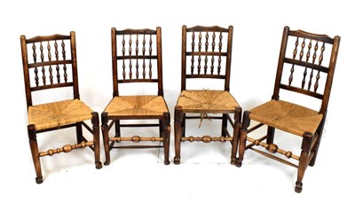 Lot 583 - Set of four oak spindle back chairs